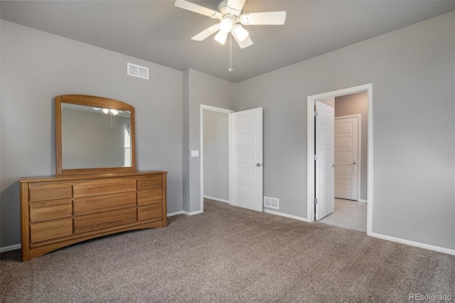 unfurnished bedroom with ceiling fan and light carpet