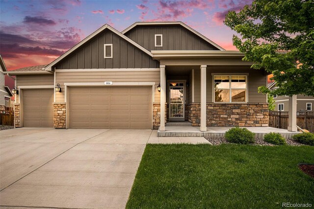 craftsman-style house with covered porch and a garage