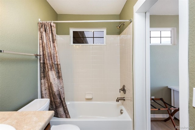 full bath featuring toilet, shower / tub combo with curtain, vanity, and wood finished floors