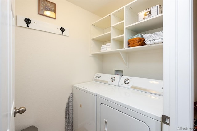 clothes washing area with laundry area and separate washer and dryer