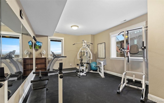 12648 Waterside Ln, Longmont, CO 80504 - workout room featuring baseboards