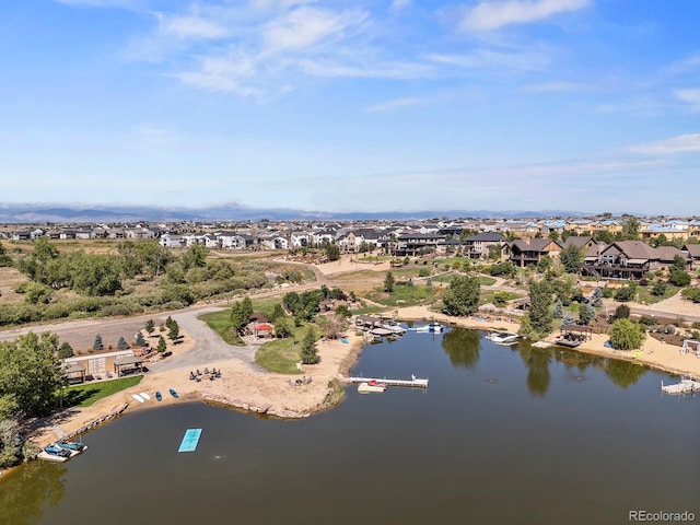 12648 Waterside Ln, Longmont, CO 80504 - aerial perspective of suburban area with a large body of water
