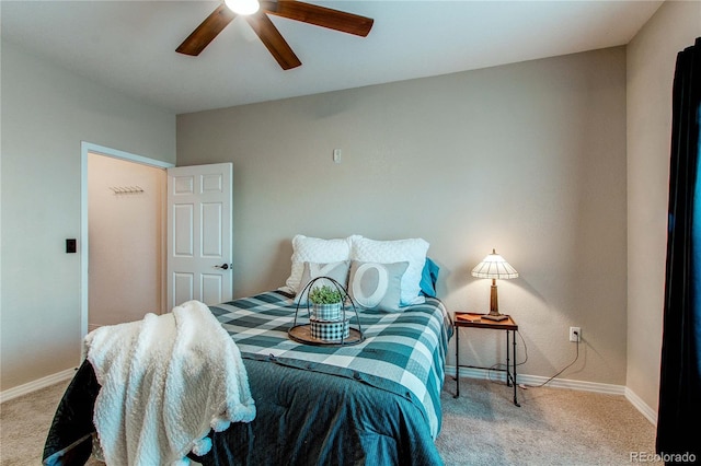 bedroom featuring ceiling fan and light carpet