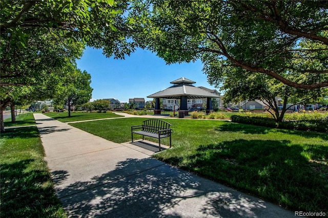 view of property's community with a gazebo and a yard