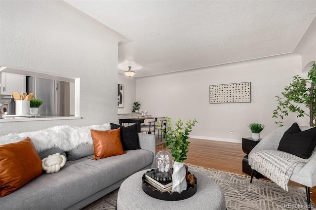 1454 Jersey St Unit 104, Denver, CO 80220 - living area featuring wood finished floors and baseboards
