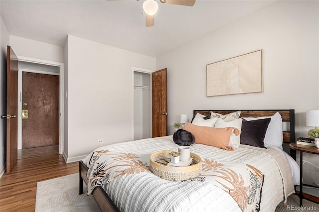 1454 Jersey St Unit 104, Denver, CO 80220 - bedroom featuring wood finished floors, a closet, baseboards, and a ceiling fan
