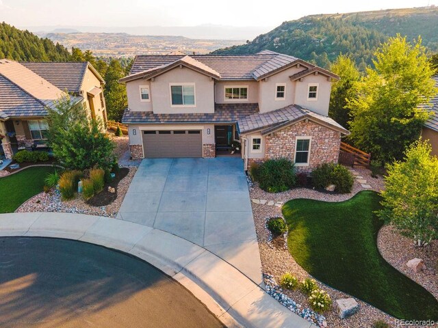 view of front of house featuring a mountain view and a garage