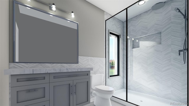 bathroom featuring toilet, tile walls, vanity, and a stall shower
