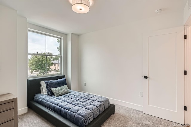115 W 2nd Ave Unit 101, Denver, CO 80223 - bedroom featuring light colored carpet and baseboards