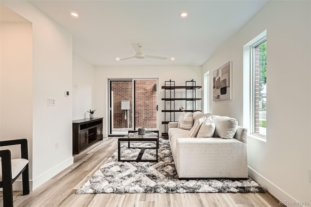 115 W 2nd Ave Unit 101, Denver, CO 80223 - living area featuring plenty of natural light, light wood finished floors, ceiling fan, and recessed lighting