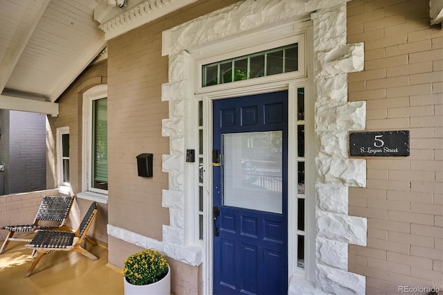 doorway to property featuring covered porch