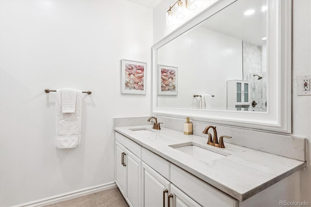 bathroom featuring a shower, vanity, and tile patterned flooring