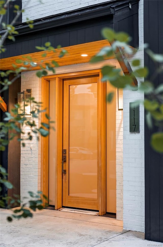1117 S Madison St, Denver, CO 80210 - doorway to property featuring brick siding