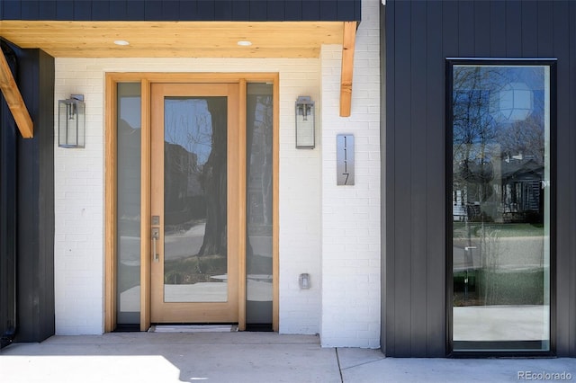 1117 S Madison St, Denver, CO 80210 - view of exterior entry featuring brick siding