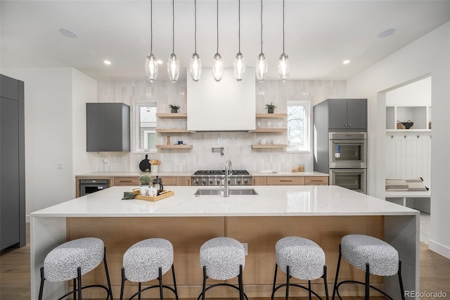 1117 S Madison St, Denver, CO 80210 - kitchen featuring open shelves, a sink, stainless steel double oven, dark wood-style floors, and gray cabinets