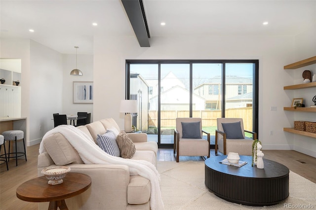 1117 S Madison St, Denver, CO 80210 - living room featuring light wood finished floors, recessed lighting, beamed ceiling, and baseboards