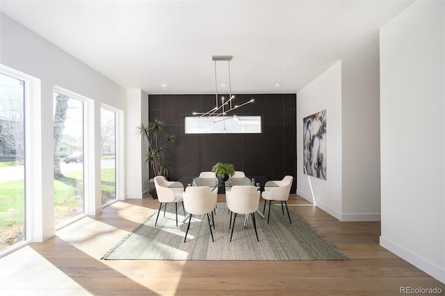1117 S Madison St, Denver, CO 80210 - dining area featuring light wood-type flooring and baseboards