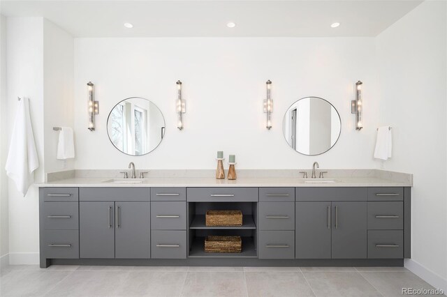 1117 S Madison St, Denver, CO 80210 - full bathroom featuring double vanity, baseboards, and tile patterned floors