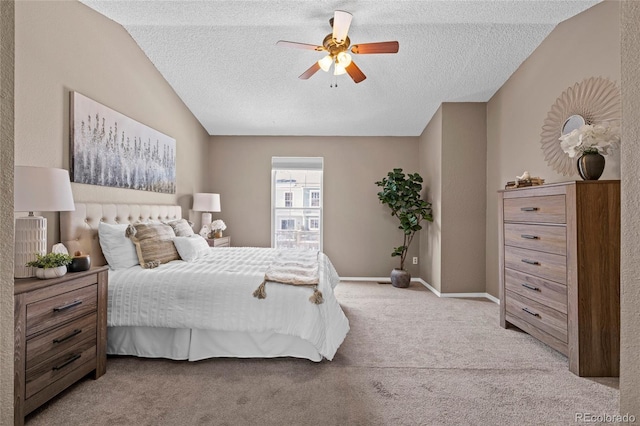 bedroom with light carpet, ceiling fan, a textured ceiling, and baseboards