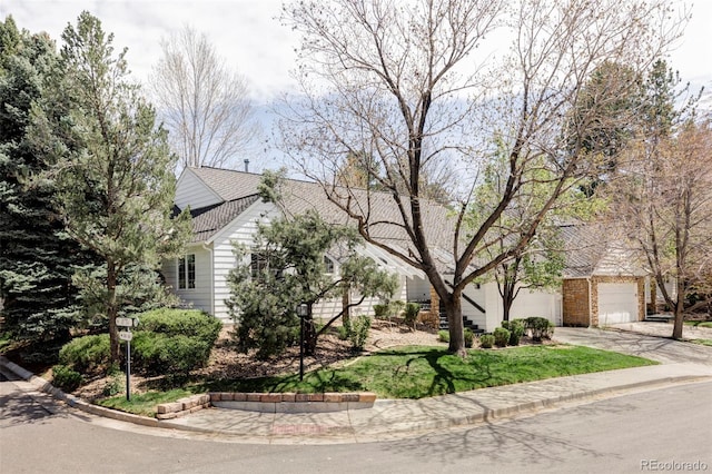 view of front of home with concrete driveway and a garage