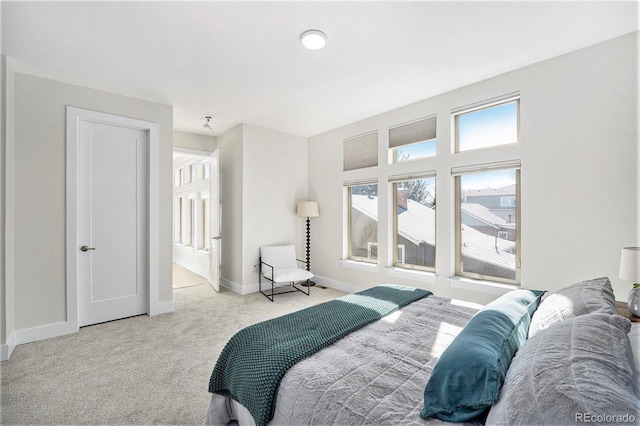 bedroom featuring baseboards and carpet flooring