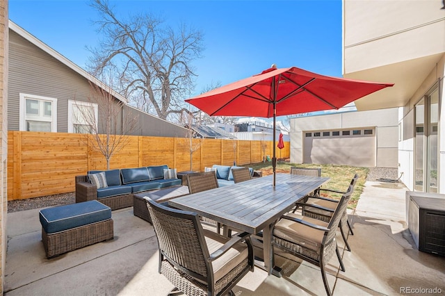 view of patio featuring outdoor lounge area, outdoor dining area, and a fenced backyard