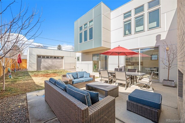 view of patio / terrace with fence, outdoor dining area, and an outdoor living space