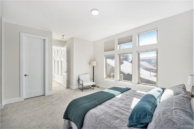 carpeted bedroom with baseboards
