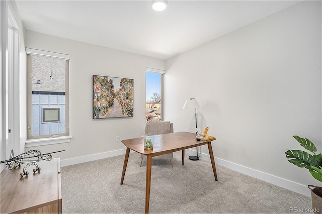 carpeted office with baseboards