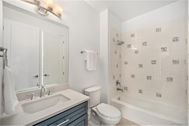full bath featuring vanity, washtub / shower combination, and toilet