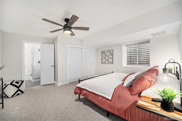 bedroom with visible vents, a ceiling fan, a closet, baseboards, and carpet flooring