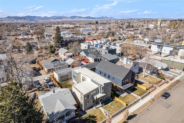 drone / aerial view featuring a residential view and a mountain view