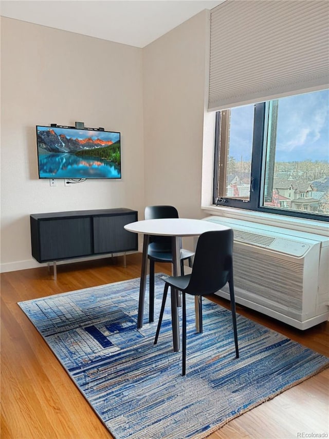 603 Inca St Unit 429, Denver, CO 80204 - dining area with wood finished floors and baseboards