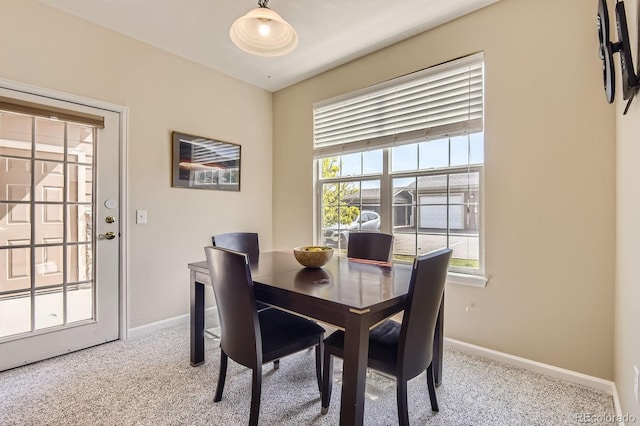 7440 S Blackhawk St Unit 4-102, Englewood, CO 80112 - carpeted dining area featuring baseboards