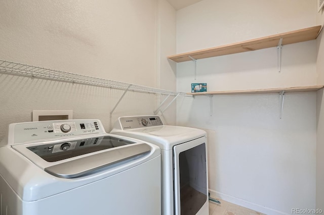 7440 S Blackhawk St Unit 4-102, Englewood, CO 80112 - washroom featuring washer and dryer