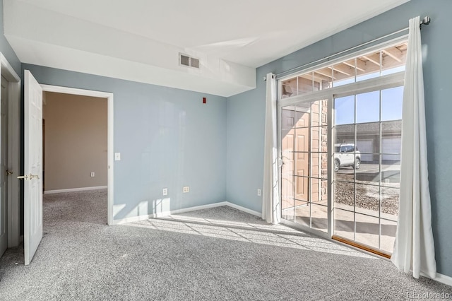 7440 S Blackhawk St Unit 4-102, Englewood, CO 80112 - empty room featuring carpet and baseboards