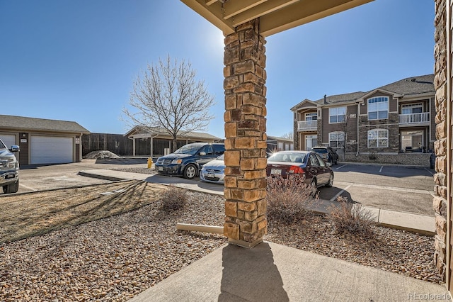 7440 S Blackhawk St Unit 4-102, Englewood, CO 80112 - view of yard featuring a garage and a residential view