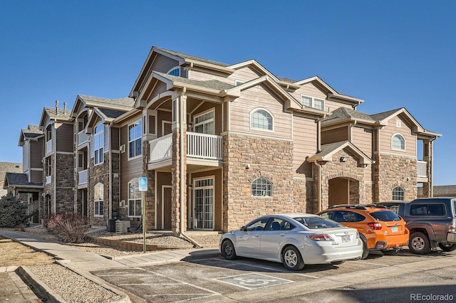 7440 S Blackhawk St Unit 4-102, Englewood, CO 80112 - view of building exterior featuring uncovered parking