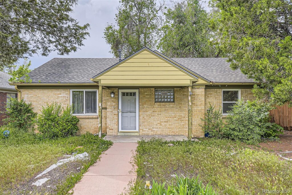 1691 Poplar St, Denver, CO 80220 - view of front of home featuring roof with shingles and brick siding