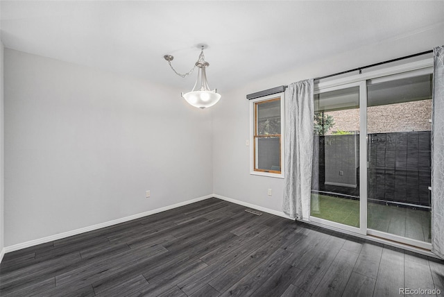 8022 W 78th Way, Arvada, CO 80005 - empty room featuring dark wood-style flooring and baseboards
