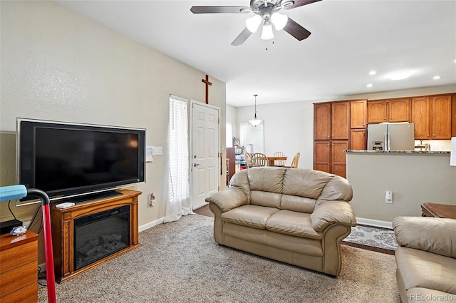 9963 E Carolina Cir Unit 104, Aurora, CO 80247 - living room with ceiling fan, carpet floors, baseboards, and recessed lighting