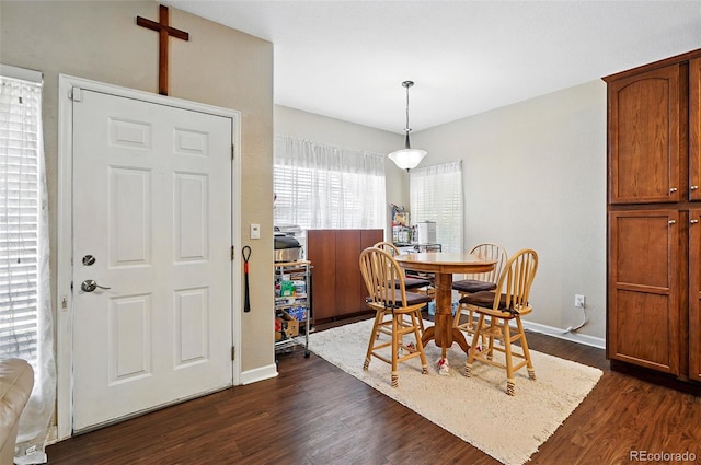 9963 E Carolina Cir Unit 104, Aurora, CO 80247 - dining space featuring dark wood-type flooring and baseboards