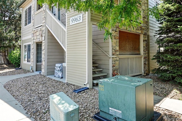 9963 E Carolina Cir Unit 104, Aurora, CO 80247 - view of side of home with stone siding