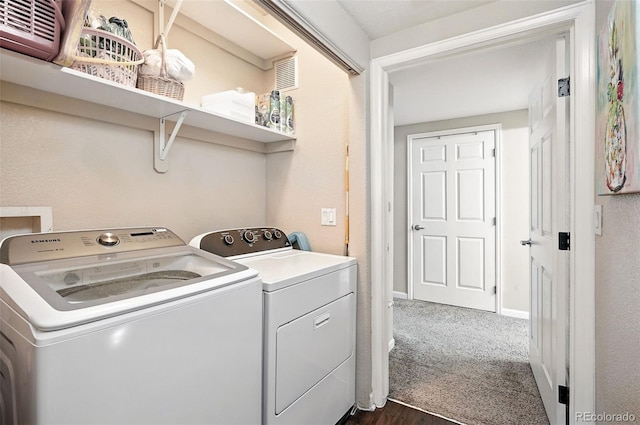 9963 E Carolina Cir Unit 104, Aurora, CO 80247 - laundry room featuring independent washer and dryer, dark wood finished floors, baseboards, and dark carpet