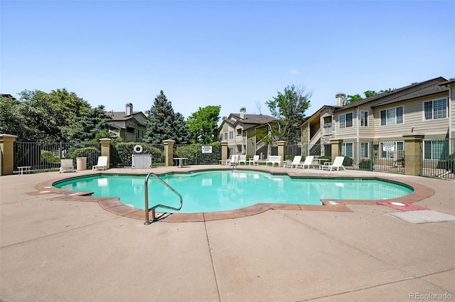 9963 E Carolina Cir Unit 104, Aurora, CO 80247 - community pool with a patio and a residential view