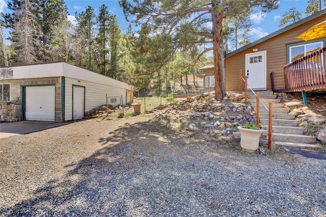 11798 Ridge Rd, Golden, CO 80403 - view of yard featuring driveway, an outdoor structure, and fence