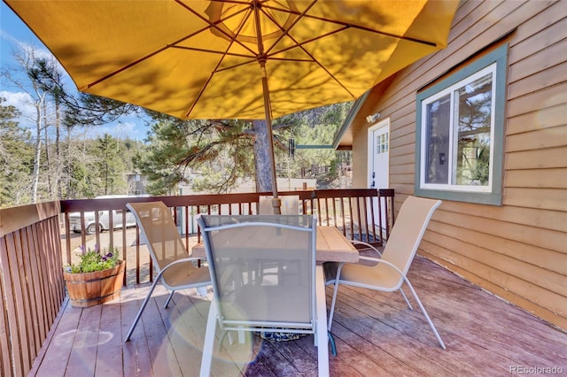 11798 Ridge Rd, Golden, CO 80403 - wooden terrace featuring outdoor dining space