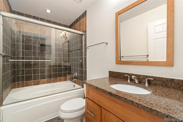 full bath featuring shower / bath combination with glass door, vanity, toilet, and recessed lighting