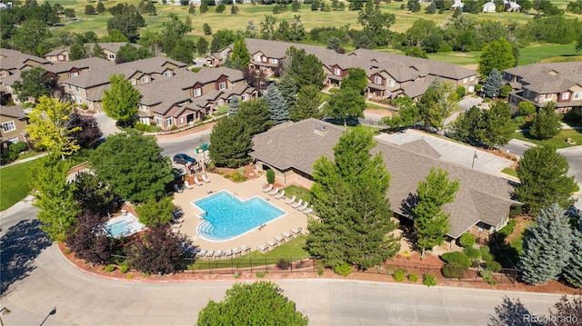 birds eye view of property with a residential view