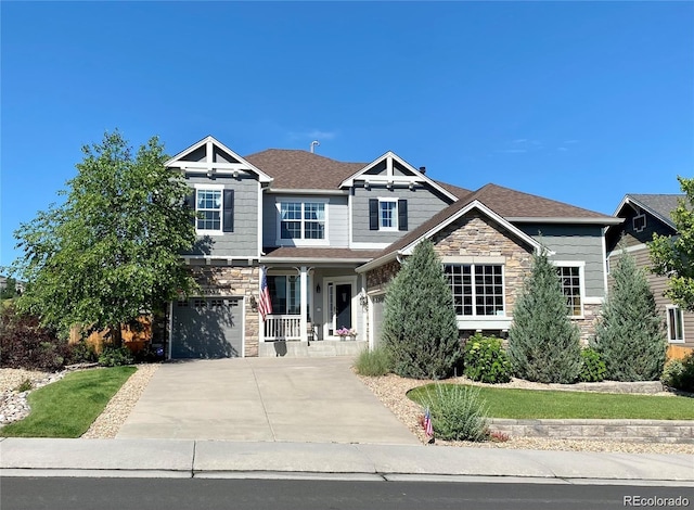 craftsman-style house with a porch and a garage